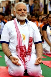 "The image shows Indian Prime Minister Shri Narendra Modi performing yoga." in blog post  which  focus 🧘keyword  is Alo Yoga.